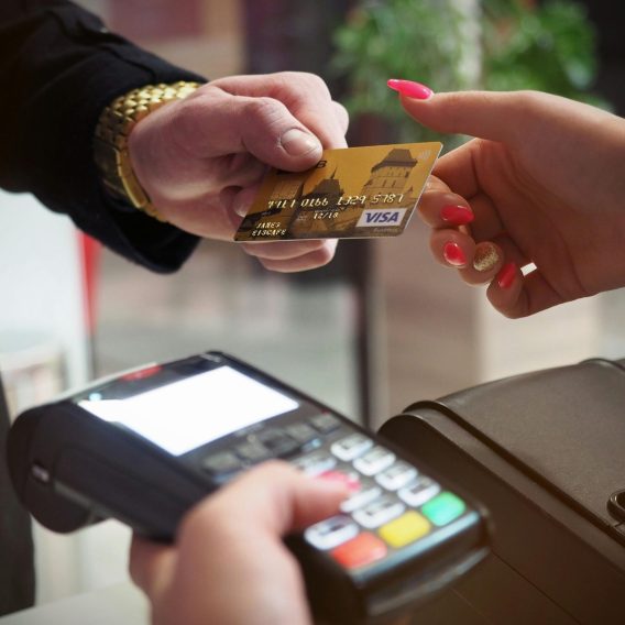 pexels-photo-2988232-2988232 Close-up of a credit card payment being processed at a POS terminal.